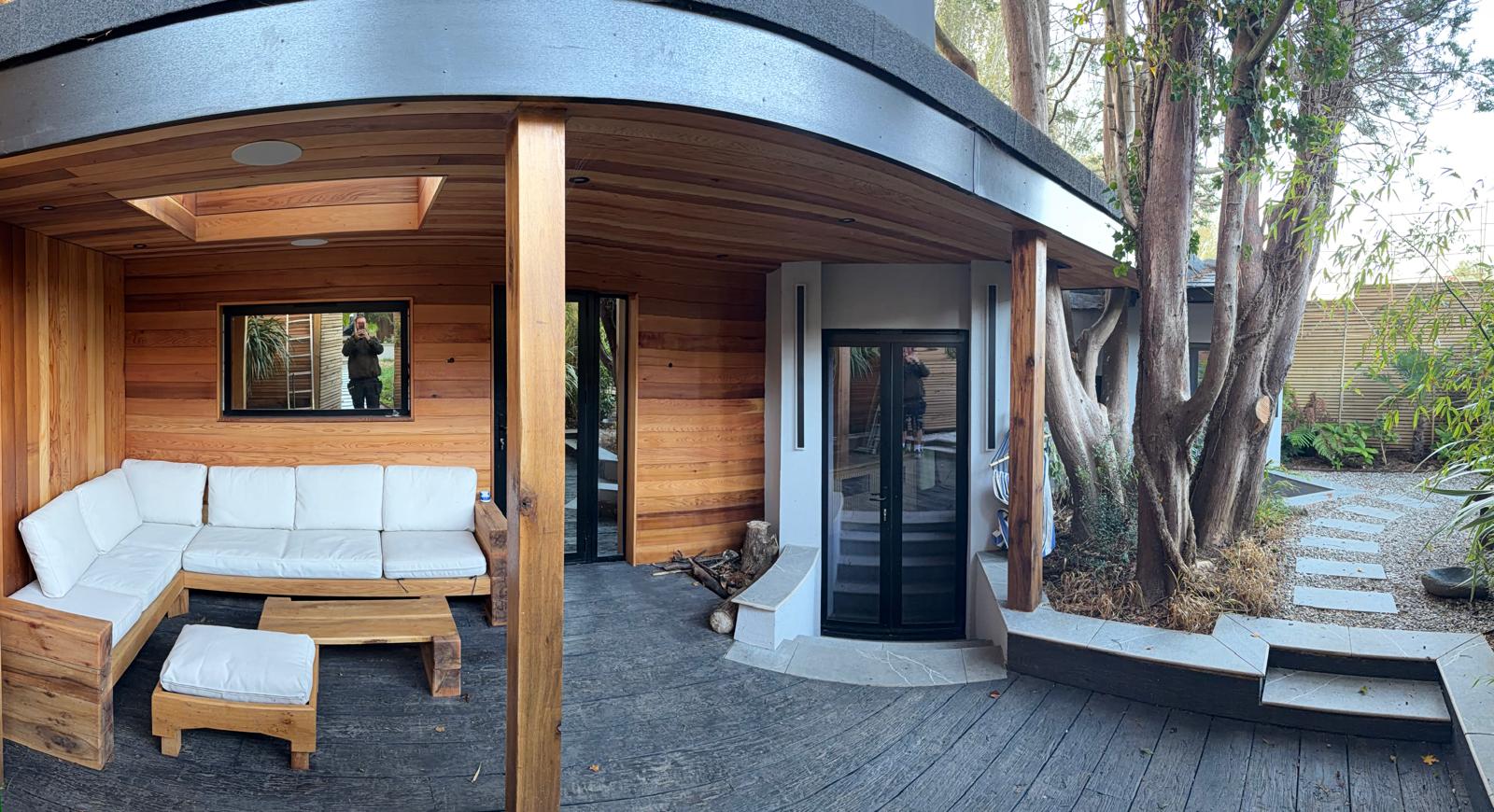 Altoria’s curved timber garden room and covered outdoor seating area